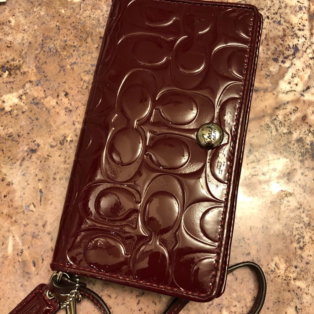 Coach burgundy patent leather wristlet